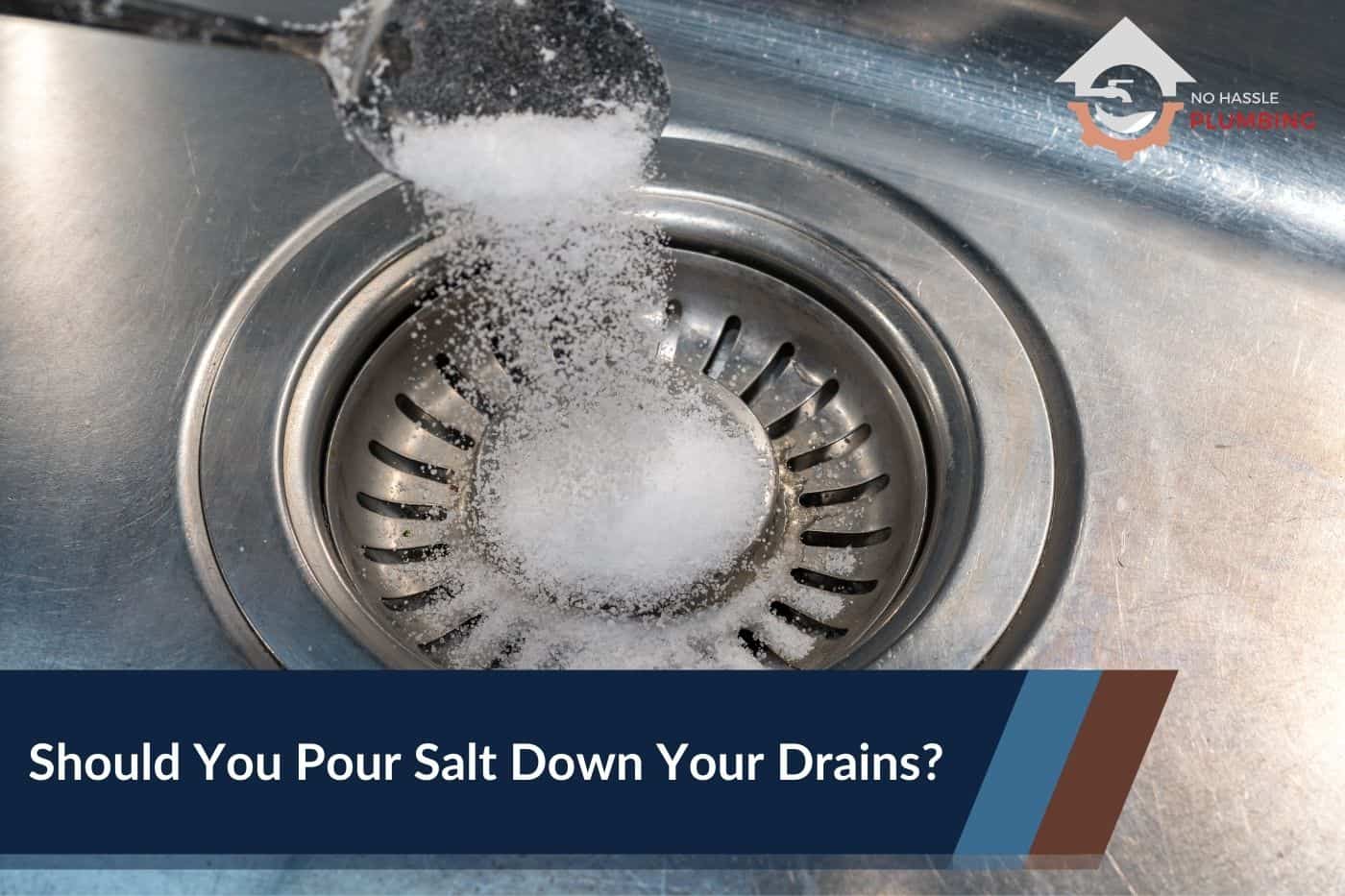 Should You Pour Salt Down Your Drains - No Hassle Plumbing.com Featured Image showing a tablespoon of salt being poured down a sink drain.