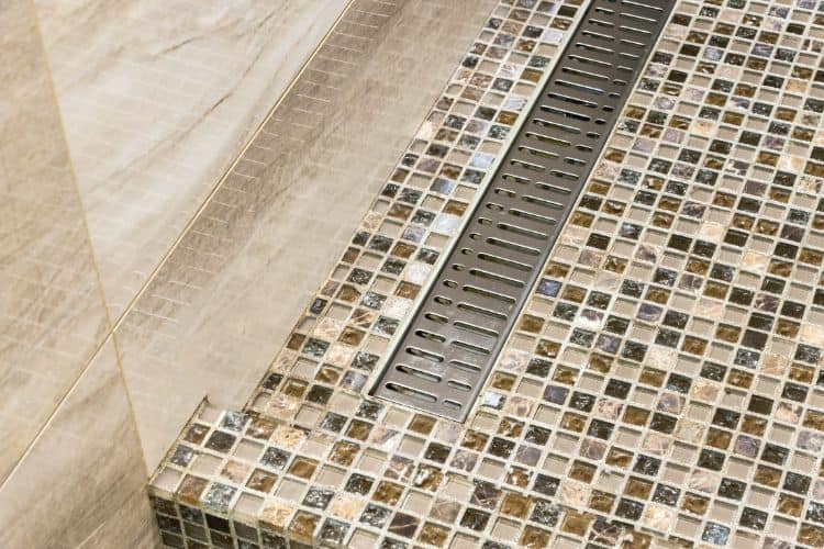 linear shower drain on mosaic shower floor