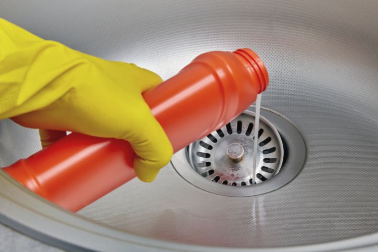 pouring drain cleaner down the drain