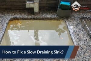 How to Fix a Slow Draining Sink - No Hassle Plumbing.com Feature Image of an kitchen sink full of dirty standing water